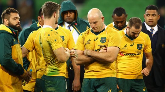 Downcast: Wallabies captain Stephen Moore and teammates look dejected after losing the series in Melbourne.