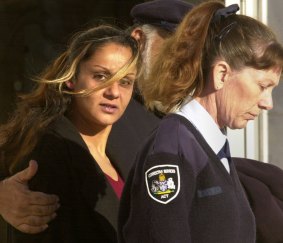 Anu Singh leaves the Supreme Court in 2004 with her father and a Corrective Services officer.
