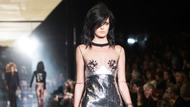 A model hits the catwalk for Tom Ford. 