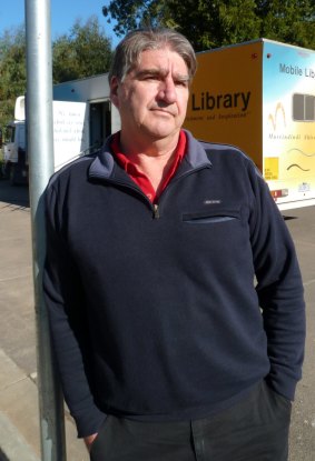 Scars reamin: John Branton, Murrindindi Shire Council's mobile librarian, says more and more people are visiting Marysville for the first time.