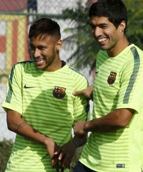 Chomping at the bit: Luis Suarez and Barcelona teammate Neymar.