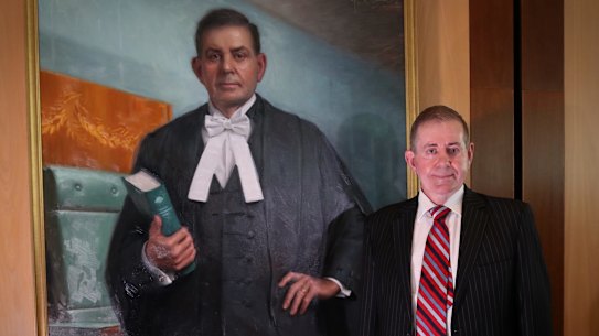 Former speaker Peter Slipper with his new portrait hanging at Parliament House.