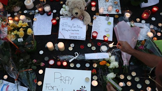 People lay tributes on the Promenade des Anglais on Friday evening in Nice.