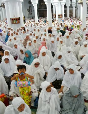 A child among the mourners at Banda Aceh's main mosque.