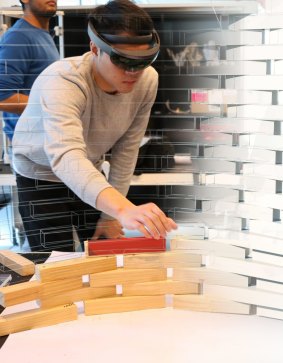 A research assistant replaces traditional documentation of a timber structure with a holographic template.