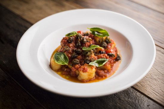 Potato gnocchi with tomato sugo and deep-fried capers.
