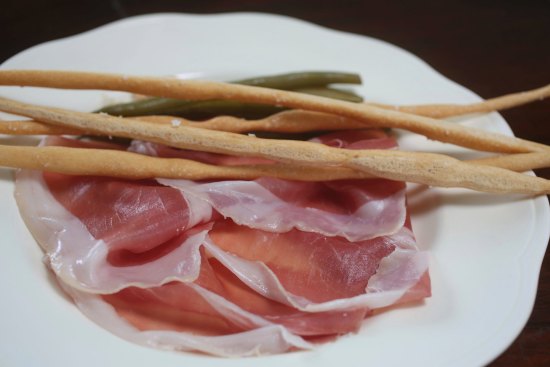 Go-to dish: Prosciutto di Parma with pickled green beans and hand-rolled grissini.