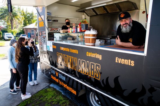 Husband and wife owners of 2 Smokin' Arabs food truck Sarah and Nawaf Refai in their Punchbowl front yard.