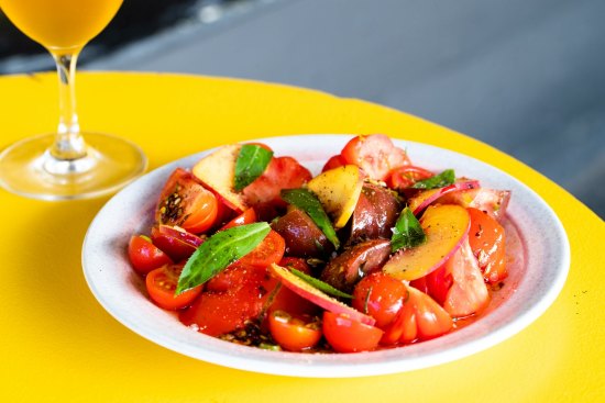 Tomatoes and peaches with tarragon, crispy chilli and fennel seed.