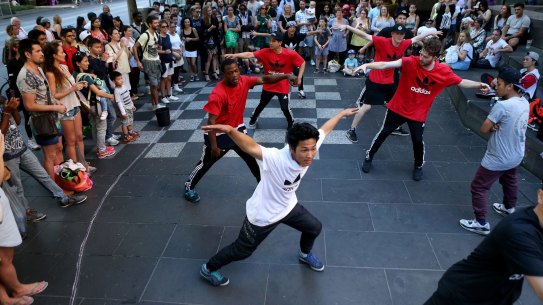 We're the best: The Young Masters break-dancing crew perform in Swanston Street.
