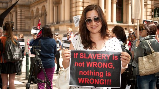 Protestors rally against slavery of migrant workers in Qatar in Sydney in 2013. 