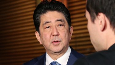 Japanese Prime Minister Shinzo Abe speaks to reporters  on Wednesday. The missile landed in waters off Japan.