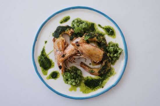 King prawns with green tomatoes and parsley. 