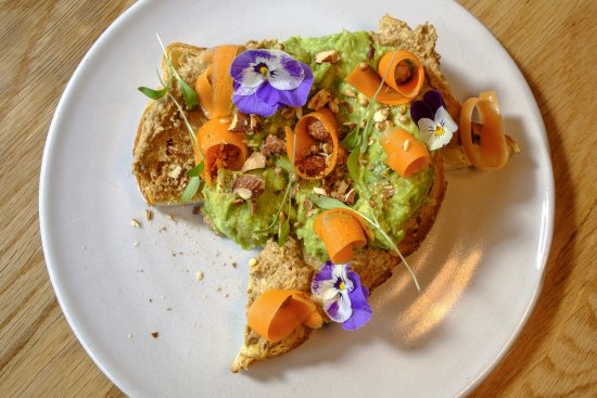 Avocado on toast with pickled carrot.
