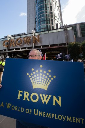 Unionists converged at Crown's flagship casino in Melbourne to protest job cuts.