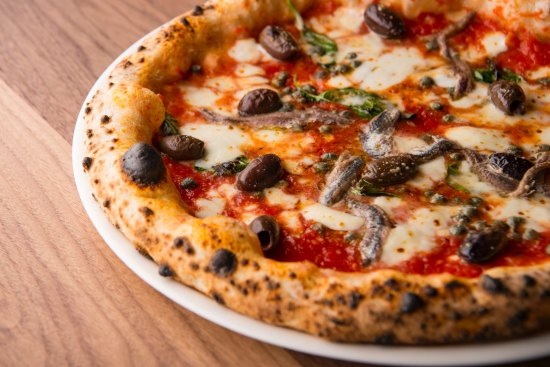 The classic napoletana carries no more than tomato, fior di latte, capers, olives and anchovies.