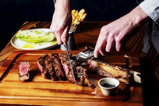 Collinson & Co grass-fed tomahawk steak with chips.