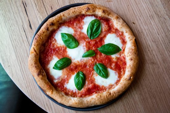 Tomato, buffalo mozzarella and basil pizza. 