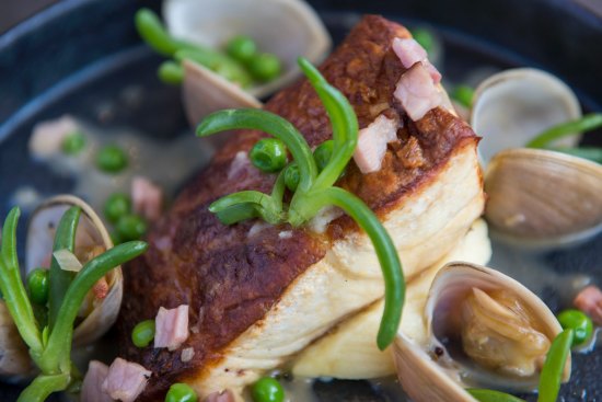 Freshly caught fish with surf clams, bacon and peas.