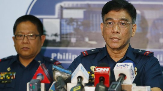 Philippine National Police Spokesman Wilben Mayor, right, and PNP Crime Laboratory Chief Emmanuel Aranas after reading a statement on the beheading of a Canadian hostage earlier this month. 