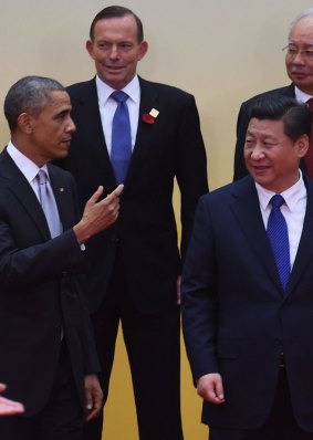 Lonely stand: Prime Minister Tony Abbott behind US President Barack Obama and Chinese President Xi Jinping.