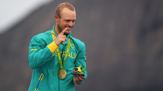 Sailor Tom Burton after accepting his gold medal in the laser class.