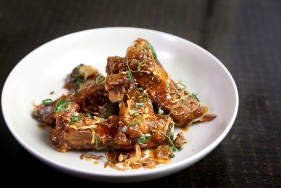 Finger lickin' twice-cooked, sweet and sour pork ribs with palm sugar and tamarind.  