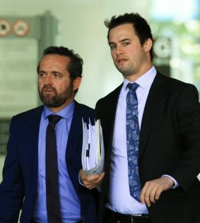 Defence lawyer Dennis Kinsella (left) and his associate leave the court.