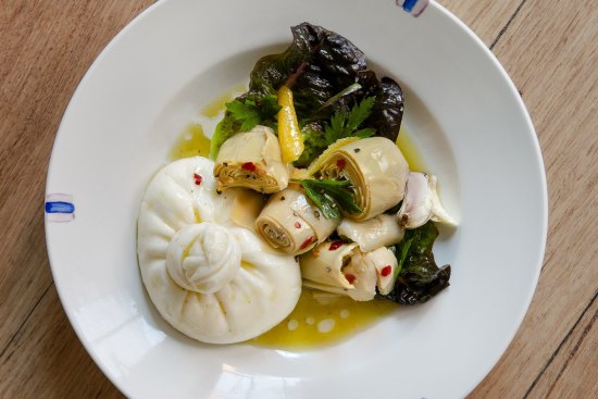 Burrata with artichokes and nettle oil.