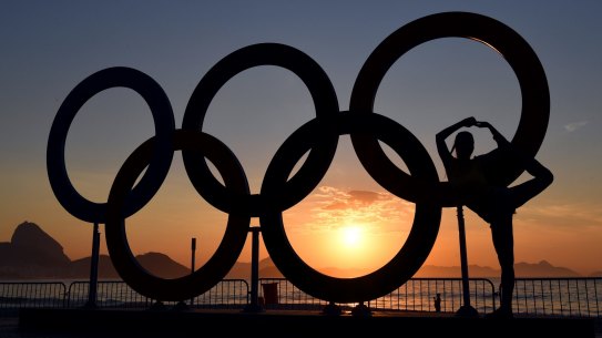 The Olympics rings at sunrise on Copabana Beach.
