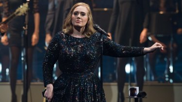 Adele, pictured performing in Paris, says she was asked to perform at the Super Bowl.