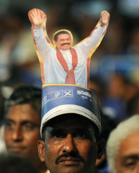 A Rajapaksa supporter at a rally on Monday.