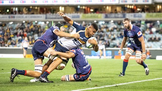 The Brumbies' Rob Valentini scores a try in the first half. 