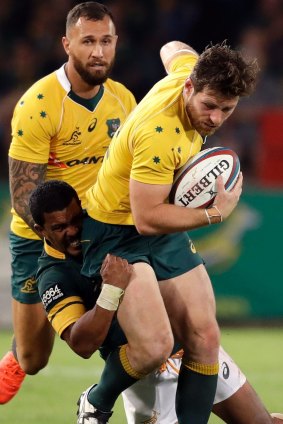 Bernard Foley is tackled by South Africa's Rudy Paige.