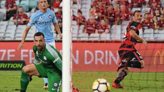 Game-breaker: Mark Bridge rolls the ball into the back of the net as City keeper Dean Bouzanis can only watch helplessly.