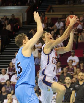 Brisbane reserve guard Matt Kenyon attacks the basket against New Zealand.