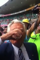 Bob Hawke skolls a beer during the Australia vs India Cricket Test at the SCG in 2012.