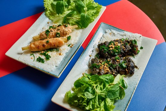 Thy Thy's rice vermicelli cakes with sugarcane prawns (left) and grilled beef and betel leaf.