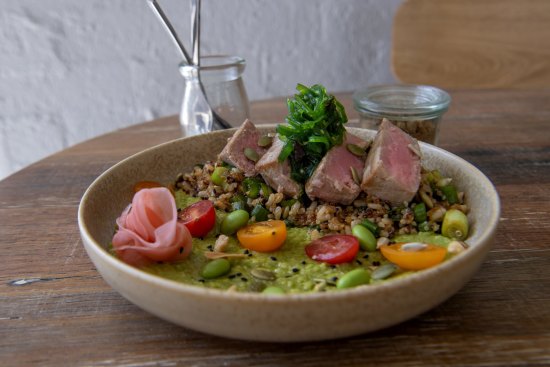 Seared tuna bowl with quinoa, brown rice, avocado, edamame, pickled ginger and seaweed.