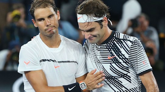 Great players, great men: Rafael Nadal congratulates Roger Federer on his Australian Open triumph. 