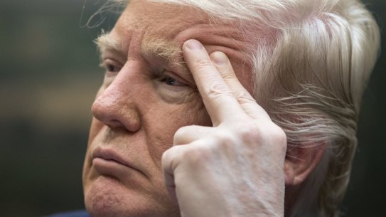 Donald Trump listens during a meeting on healthcare on Monday.