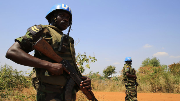 Volatile situation ... United Nations Mission in Sudan (UNAMIS) personnel guard South Sudanese people displaced by recent fighting in Jabel, on the outskirts of capital Juba.