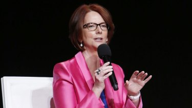 Julia Gillard speaks at a panel discussion on 'The Power of an Educated Girl' alongside Charlize Theron and Michelle Obama in 2015. 