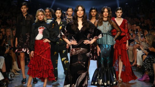 David Jones ambassadors Jessica Gomes (centre) and Jesinta Franklin (right), and model Megan Irwin (left) in the finale of the Gala Runway at the Melbourne Fashion Festival on Tuesday night.