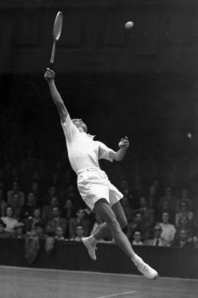 British tennis player Tony Mottram leaps during his second round Davis Cup match against Jaroslav Drobny of Czechoslovakia at Wimbledon.
