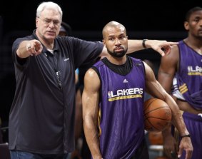 Parting of the ways: Phil Jackson and Derek Fisher during their time together at the LA Lakers in 2010.