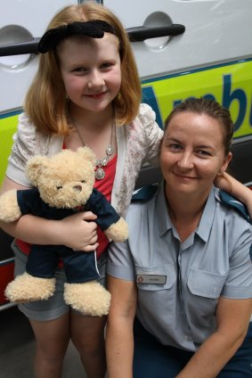 Mia Moyle, 8, and emergency medical dispatcher Rachel Colbourne who took her Triple 0 call.