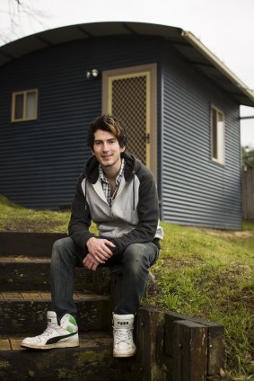 New home: Sebastian, 21 ,outside his studio, which was provided by Kids Under Cover.