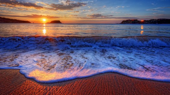 One of Belize's beautiful beaches. A website based in the country, TitanTrade, is accused of siphoning off millions of dollars from Australian investors.