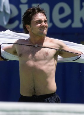 Andrew Ilie rips his shirt off after beating Juan Carlos Ferrero in 2001.